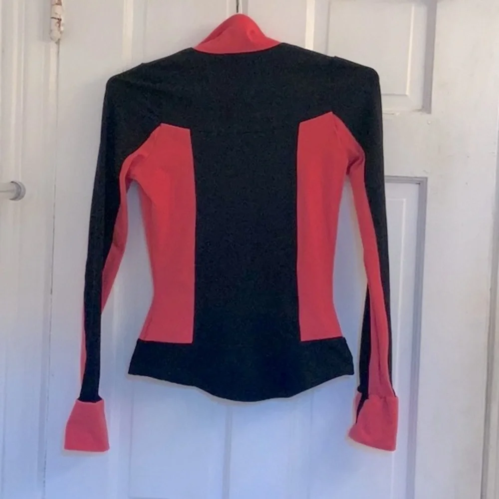 Mondor girls black and coral skating jacket in size 12 - 14